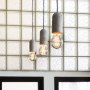 Dehavilland Studios, East London | Detail of new island pendant lights and glass blocks | Interior Designers